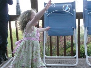 CareBear reaches for a bubble.