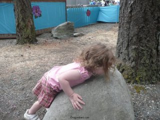 So she tries to lift the rock.