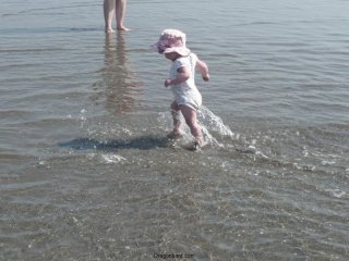 LiliBee chases the waves.