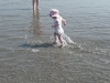 LiliBee chases the waves.