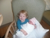 LiliBee likes holding the new baby.