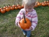 LiliBee is proud of her pumpkin.