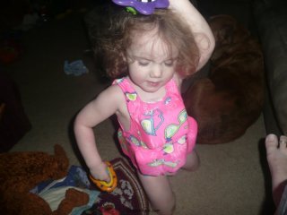 CareBear dances with the bath toys.