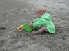 LiliBee makes a sand castle.