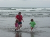 The waves are chasing CareBear, Amy and Cousin H!