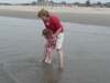 Auntie T saves CareBear from a giant wave.