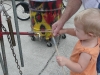 LiliBee bangs a drum.