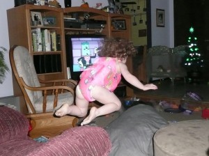 Wearing a padded swim suit and "diving" onto the dog bed!